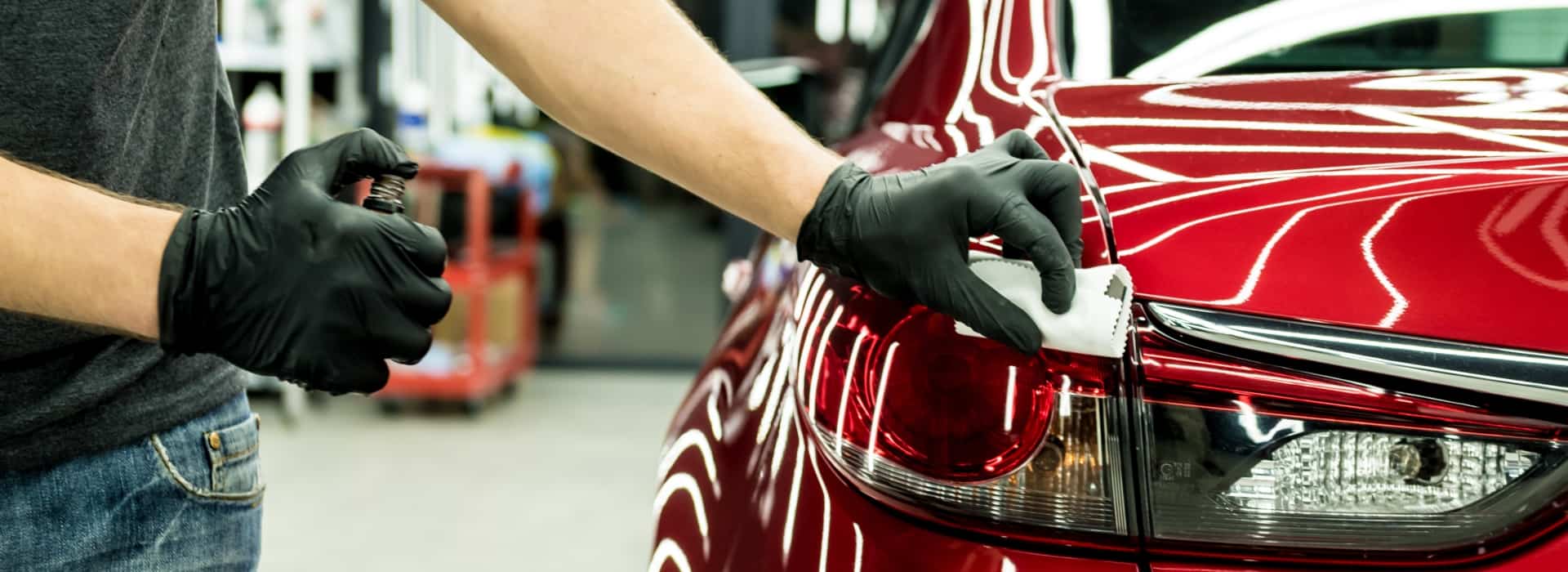 Surface protection specialist applying Ceramic Coating on Red Camry