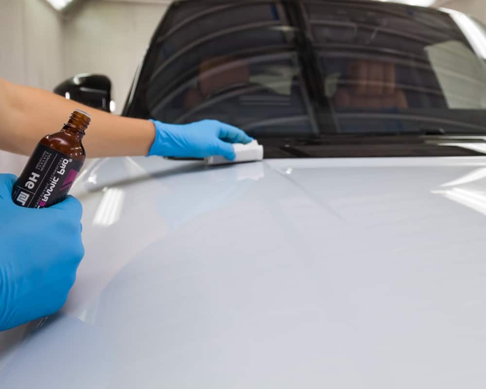 Ceramic Coating trainer applying Ceramic Pro on White Range Rover