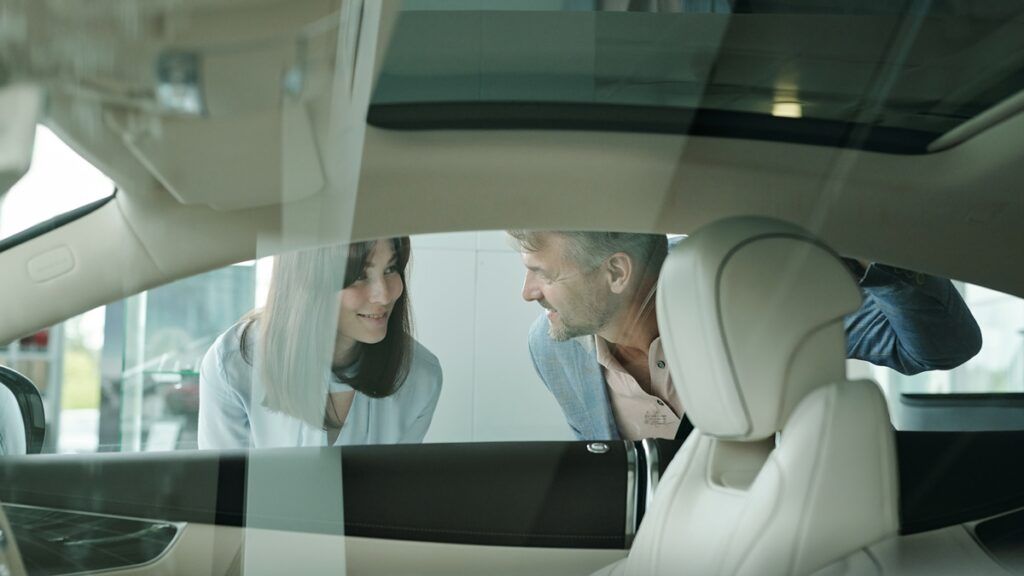 Satisfied customer admiring her newly installed ceramic window tint